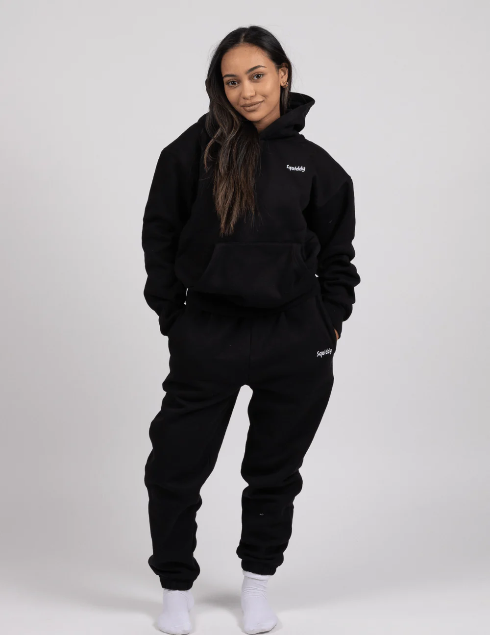 Women wears hoodie and matching joggers in black